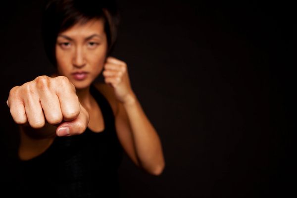 Portrait of woman practicing self defense.