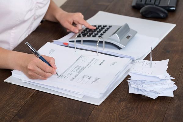 Accountant Calculating Receipt
