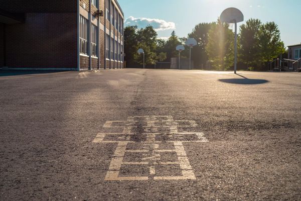 School building and school yard in the evening