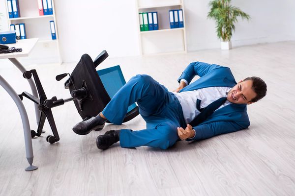Young male employee in work accident concept
