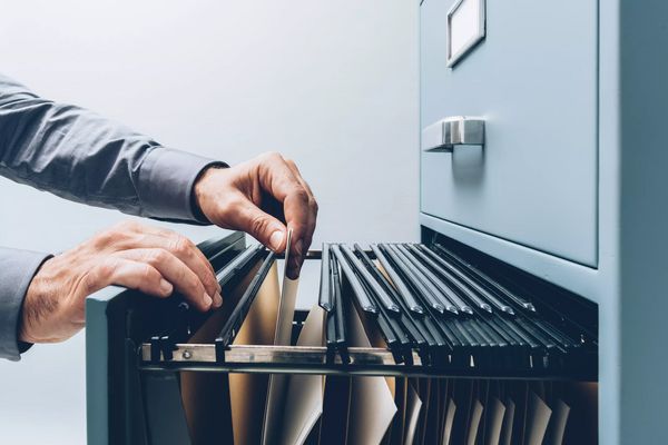 Office clerk searching for files