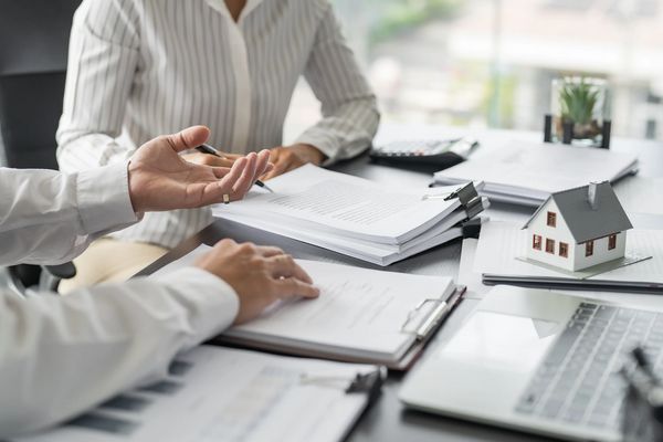 Business people signing contract making deal with real estate agent Concept for consultant home insuranceReal estate investment Property insurance security. Real estate agent