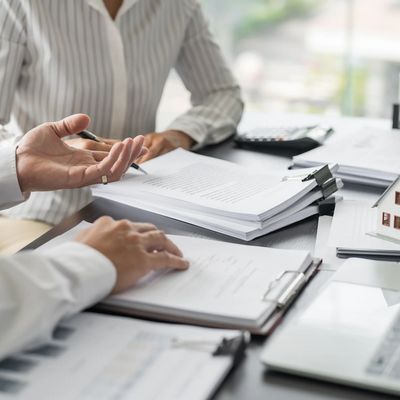 Business people signing contract making deal with real estate agent Concept for consultant home insuranceReal estate investment Property insurance security. Real estate agent